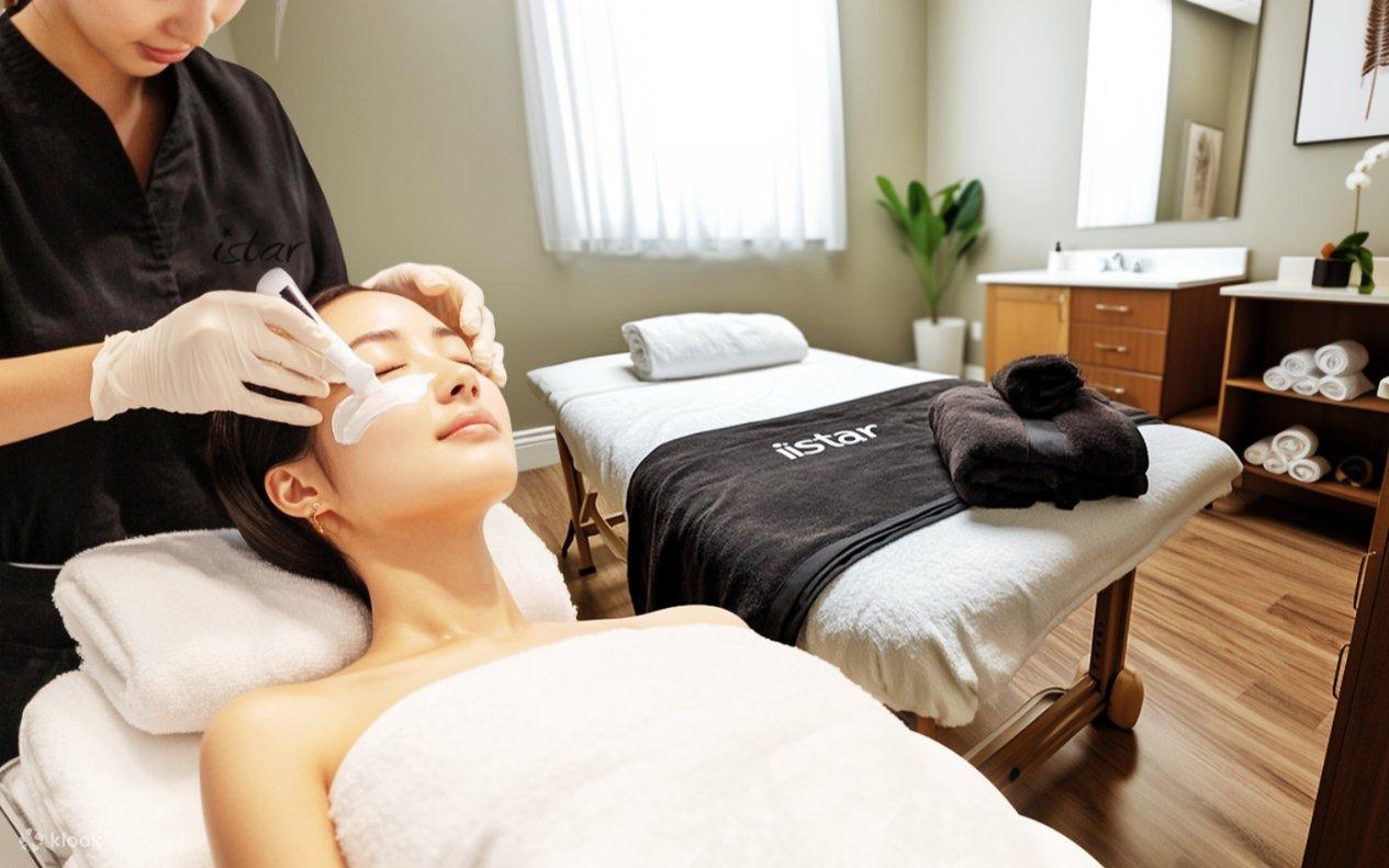Therapist applying facial care to a customer resting on a treatment bed in a calm Seoul skincare studio