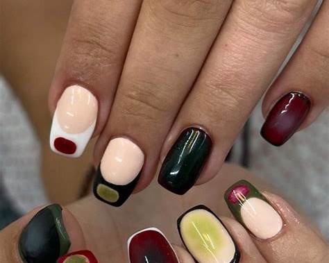 Close-up of colourful hand-painted Korean gel nail designs on short, neatly shaped nails