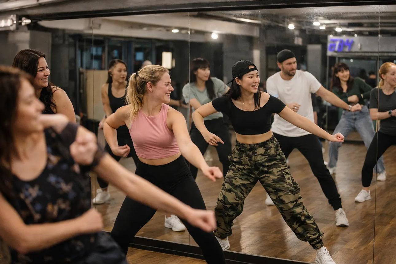 International participants dancing in front of the studio mirror during a K-Pop dance class in Seoul