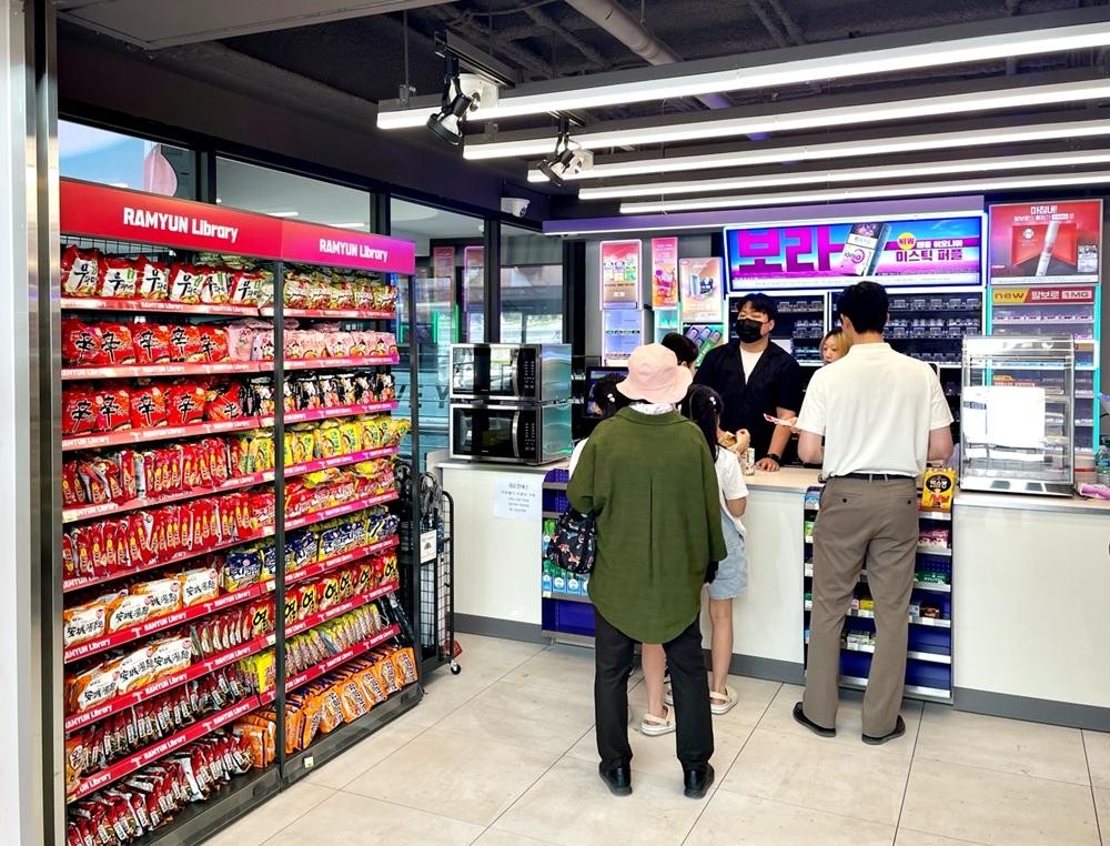 A Korean convenience store aisle filled with packages of instant noodles